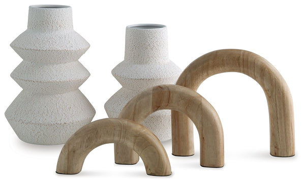 Craft a contemporary haven with the delightfully neutral tones and modern forms of this accessory set. Its sculptures, with their seamlessly streamlined arch designs, can be displayed together or stand solo as subtle statement pieces. The tiered look of t