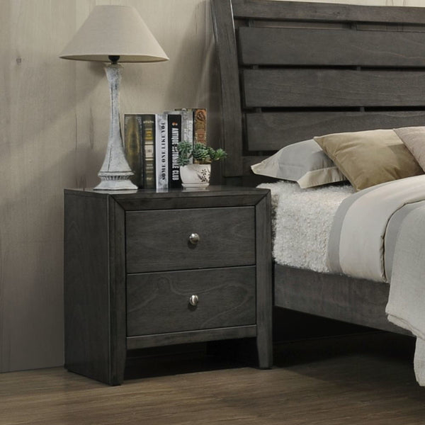 The Ilana contemporary bedroom set is expertly crafted with hand selected woods and veneers in a calming gray finish, featuring a modern slatted headboard design, low profile footboard and wooden tapered legs. With all matching case goods, this bedroom gr