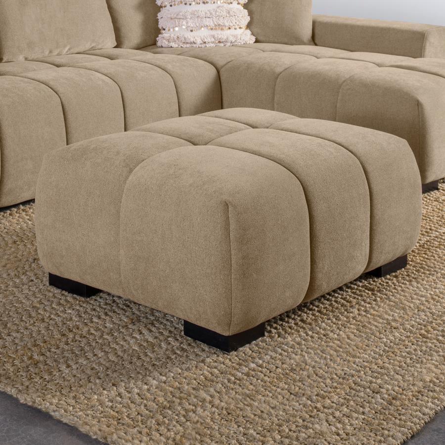 Add versatility and comfort to your seating area with this plush, mid-century inspired ottoman. Its soft, neutral upholstery and subtle grid tufting bring depth and texture to your dÃ©cor, while a sturdy frame ensures lasting durability. Ideal as a footre