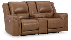 This power reclining loveseat delivers comfort and contemporary style in a big (but not bulky) way. Its supple leather and faux leather upholstery, sumptuous cushioning and one-touch control are sure to take you to your happy place. The loveseat-'s power 