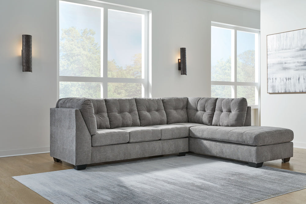 This sectional with chaise takes a homey approach to high style. Its gray coloration has classic versatility, while a contemporary silhouette and stitched details keep the look totally on trend. And you can count on comfortâ€”the chaise invites you to kic