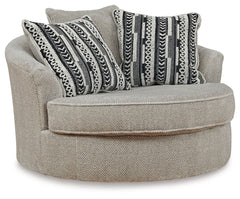 This oversized swivel accent chair caters to your need for contemporary comfort. Large in scale and decked out in feel-good fabric, it gives you space to sprawl out. And the 360-degree swivel motion makes it easy to view the TV or chat with others in your