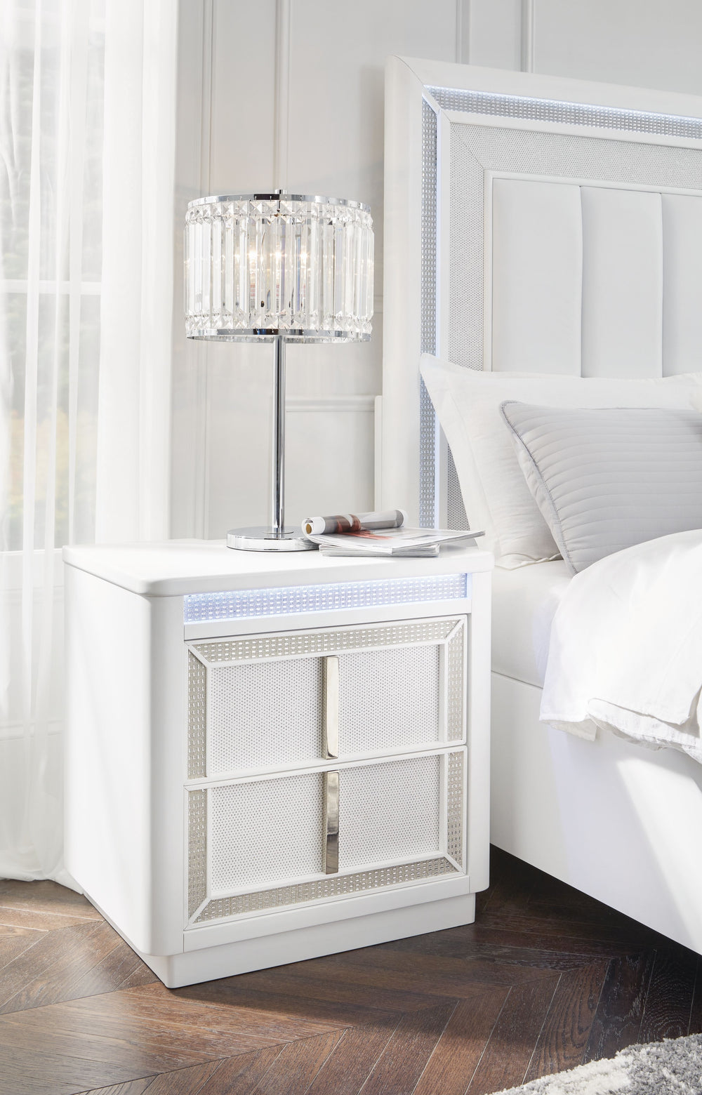 Transform your bedroom with this nightstand. Its modern design and glamorous details create a sophisticated retreat. The built-in LED lighting and rhinestone-framed drawers add style and practical storage, while USB charging keeps you connected. Let your 