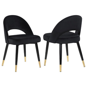 Add a touch of retro-inspired elegance to your dining room with this stylish dining side chair, featuring an elegant bucket-style seat that embodies Mid-Century modern charm. Wrapped in luxurious velvet, each chair provides a supportive, long-lasting seat