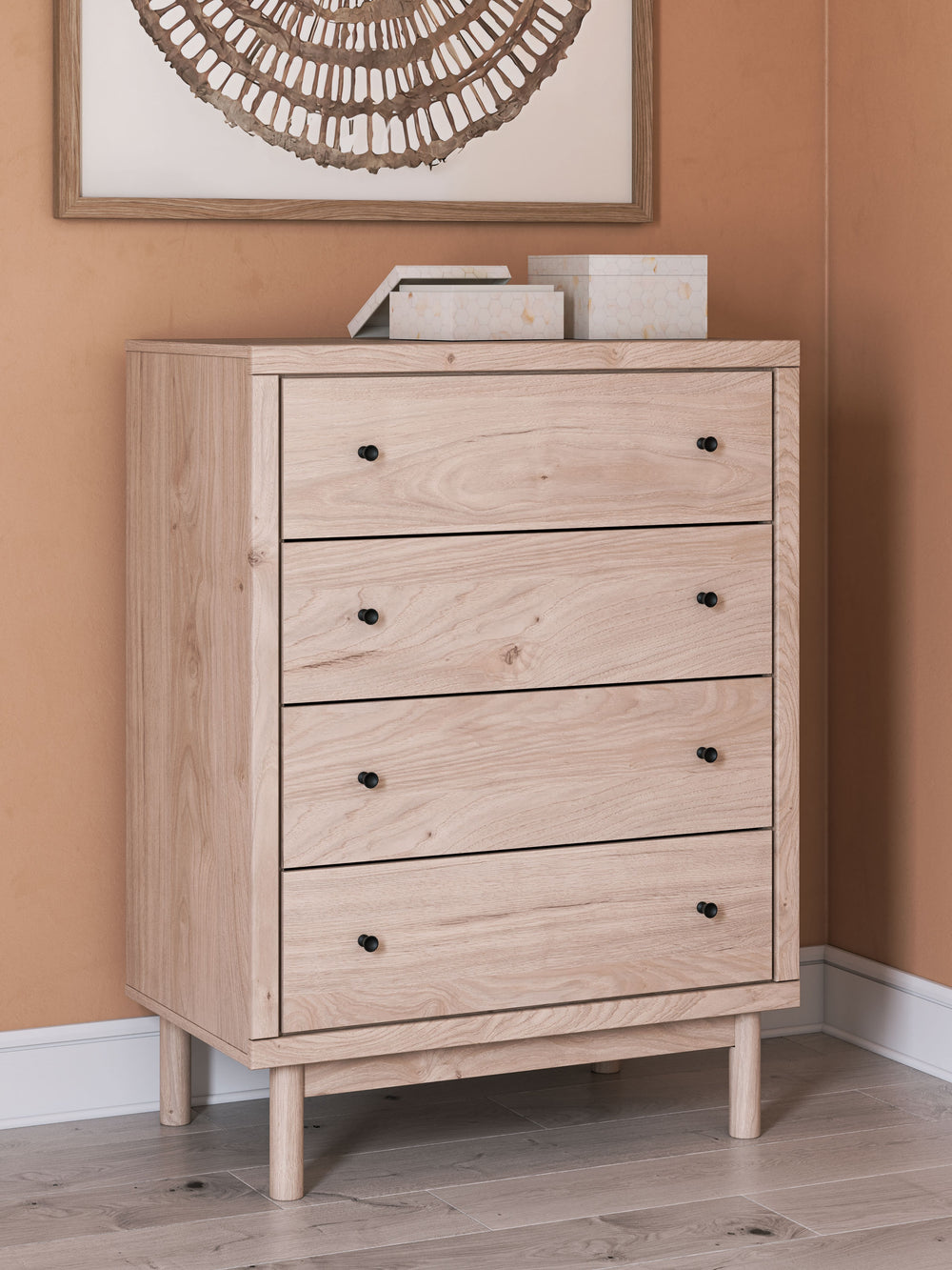Looking for a chest of drawers that-'s both playful and practical for your little one? This piece is just the ticket. Its charming design and light wood finish create a whimsical and inviting atmosphere. Four smooth-gliding drawers provide plenty of stora