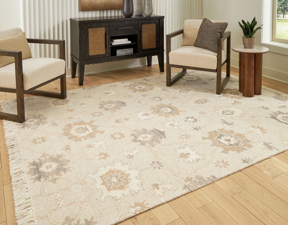 Bring modern life into balance with the rhythms and beauty of nature. This area rug has the vintage look of an heirloom. Blooming with graceful florals in neutral tones and surrounded by fringe edging, it adds style to any lounge space.<br/><br/><b>Produc