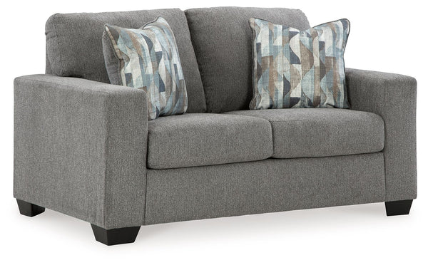 Youâ€™re in for a neat treat with this loveseat. Its comfy seats are covered in soft, textural upholstery, and the wide track arms are eager to support your quest for total relaxation. Distressed abstract toss pillows bring a fresh breath of contemporary 
