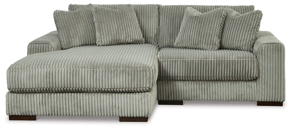 Plush and posh. Showcase your eye for on-trend texture with the statement-making cord upholstery of this sectional with chaise. Its stunningly soft fabric entices in a warm neutral hue, complementing contemporary color palettes. Sink into the cushions and