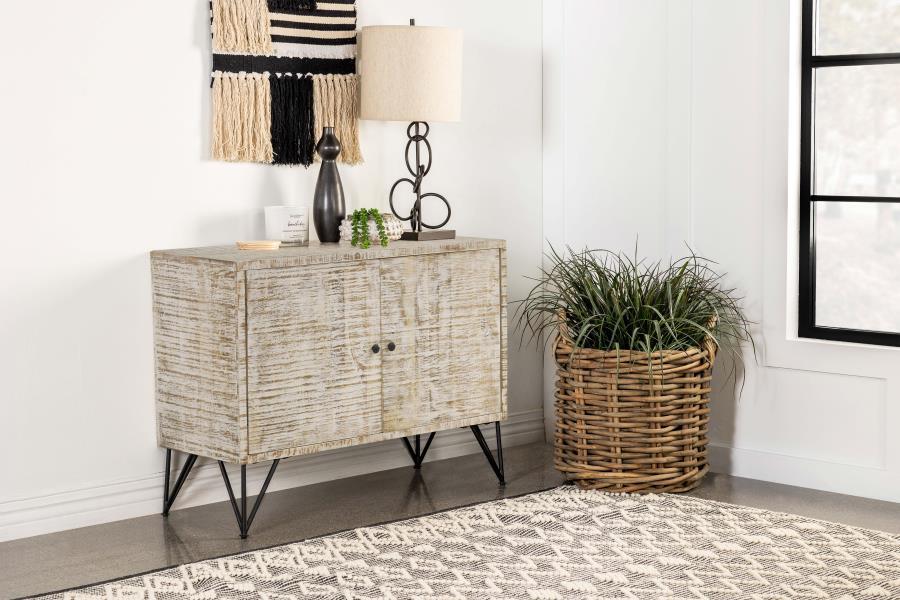 Bring a modern expression to your bohemian style space with this rustic industrial accent cabinet. A large and boxy, rectangular frame grounds a focal wall and welcomes a table lamp and decor along its narrow top surface. Double cabinet doors open up to r