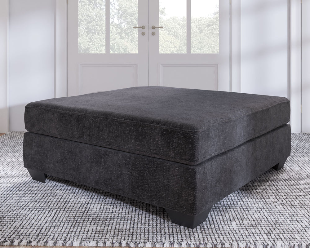 Make room for big-time comfort and style with this oversized accent ottoman. Designed to multitask as a footrest and casually cool coffee table, the firmly cushioned square ottoman is covered in a decadently soft, plush microfiber thatâ€™s love at first t