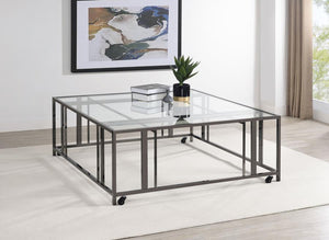  featuring a tempered glass top and a sturdy geometric base made from heavy-gauge metal. The open-frame design creates a sleek