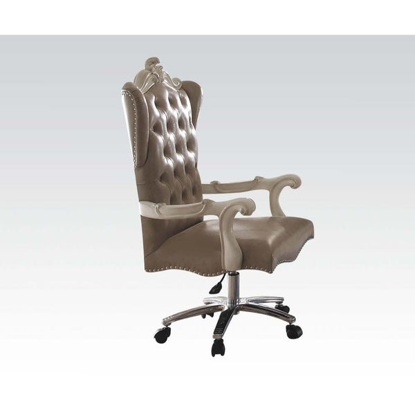 The Versailles executive arm chair classic style will blend masterfully in your home. Carefully constructed from faux leather, and selected veneers in Bone White Finish. Highly decorative details, button tufted backrest with Nailhead trim, and its decorat