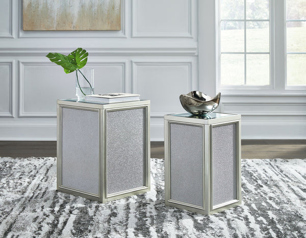  this set of nesting end tables interprets luxury in a decidedly modern way. A dazzling metallic silvertone finish and textured laminate panels for added luster enhance the star power