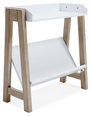 Whether for storage or display, this stylish small bookcase provides the perfect place to prop their ever-expanding book collection. The unique angled lower shelf and gallery rail top in white charmingly contrast with the light tan frame, creating a versa