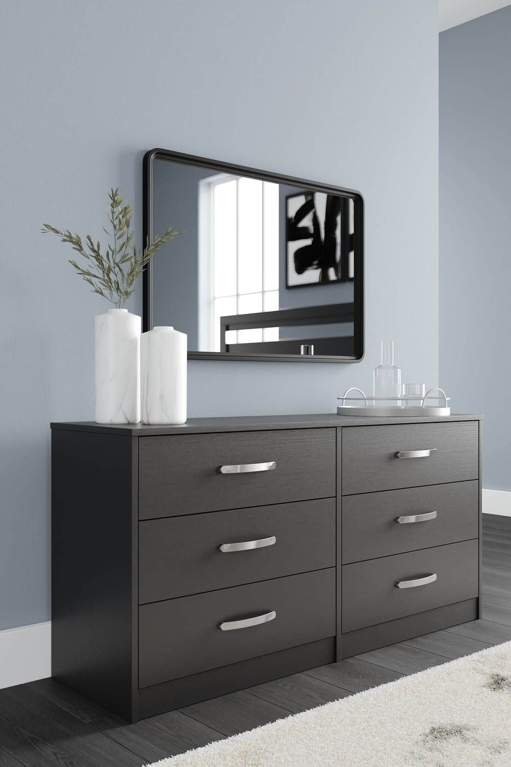 Practical and attractive, this dresser blends seamlessly with modern decor and makes a smart addition to a bedroom. The six full-sized drawers slide easily and can be used to keep your clothes neat and organized. Sleek metal pulls in a brushed nickel-tone