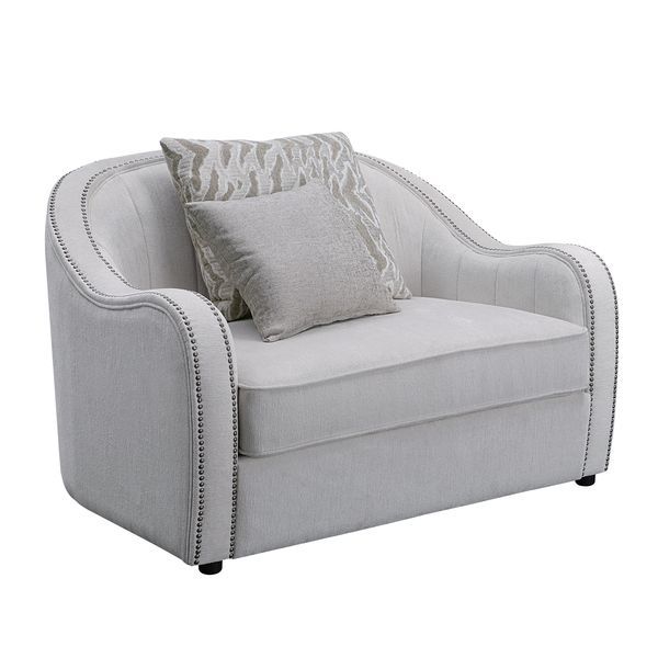 Create a clean, contemporary look with the gently curved Mahler living room set. The inner wooden frame and block plastic legs offer maximum support. Upholstered in a beige textured linen fabric and outlined with nailhead trim. The barrel seat and sloping