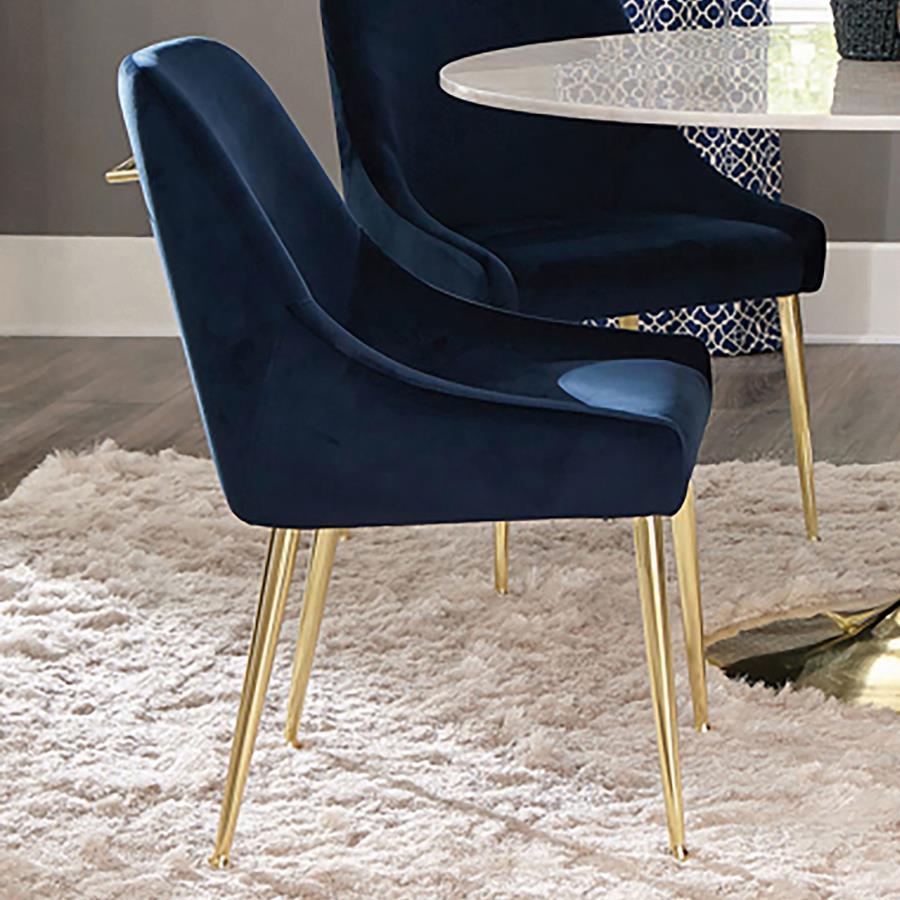 Cradle yourself in the embrace of opulence with this Italian style modern dining side chair, where comfort meets sophistication. Its plated metal legs, tapering into geometric spheres, create a foundation that-'s as sturdy as it is striking. The seat, a h