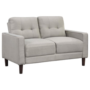 Ideal for studio apartments or small rooms, this loveseat boasts a perfect small-scale design. Its classic track arm and self-welt detailing highlight the superior tailoring. The grid-tufted boxed back cushions and pocket coil spring cushion construction 