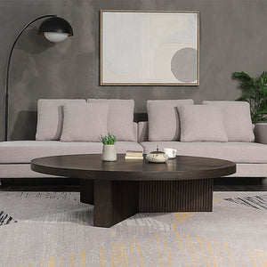 The Guido coffee table with its oak finish, exudes a blend of contemporary elegance and robust functionality. Featuring a fixed wooden table top and a round, oversized design, it is perfect for modern living spaces. The table-'s substantial presence and s