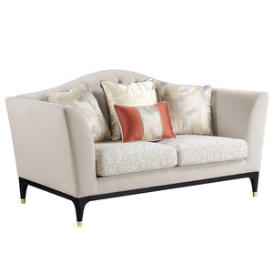The Tayden camel back sofa brings classic elegance to any living room. Sophisticated curves and crystal-like button tufting adorn the upholstered backrest. For added richness, the seat cushions are upholstered in a geometric fabric. The black base and fee