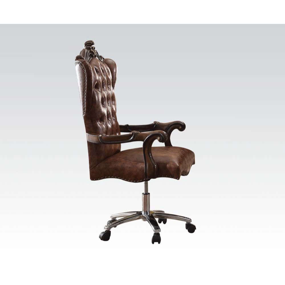 The Versailles executive arm chair classic style will blend masterfully in your home. Carefully constructed from faux leather, and selected veneers in rich Cherry Oak Finish. Highly decorative details, button tufted backrest with Nailhead trim, and its de