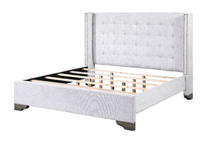 The Artesia bedroom collection provides a commanding presence in any room. This contemporary fully padded bed in tan fabric associates with button-tufted headboard with nail-head trim. Attention to details the matching case pieces are featured with raised