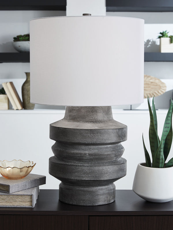  you-'ll find an expert balance of modern design and casual function. Its distressed black faux wood finish captures the essence of natural motifs while maintaining a curated sense of character. What an artistic approach to everyday i