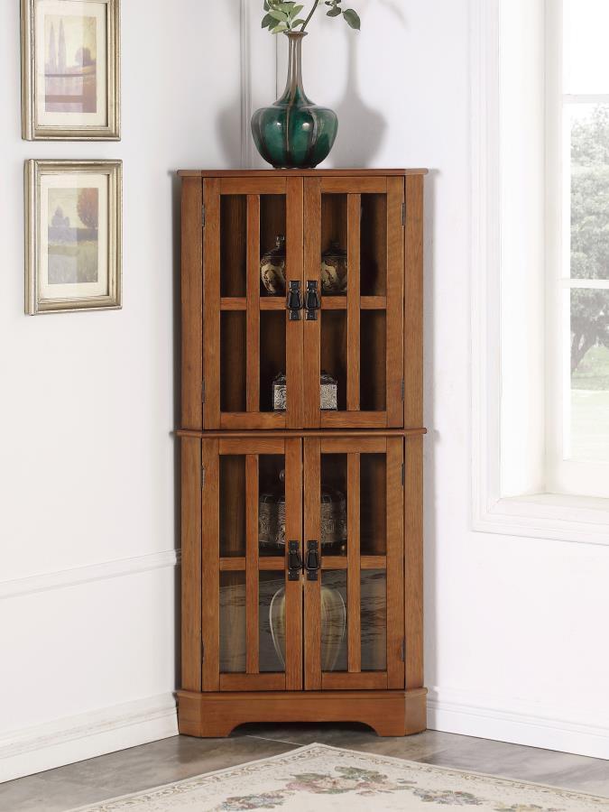 This accent cabinet is a magnificent addition to the home. It-'s designed to fit seamlessly in the corner of the living room or bedroom. It-'s crafted with four doors with window panels that has an enduring appeal. Each door opens to a space that-'s divid