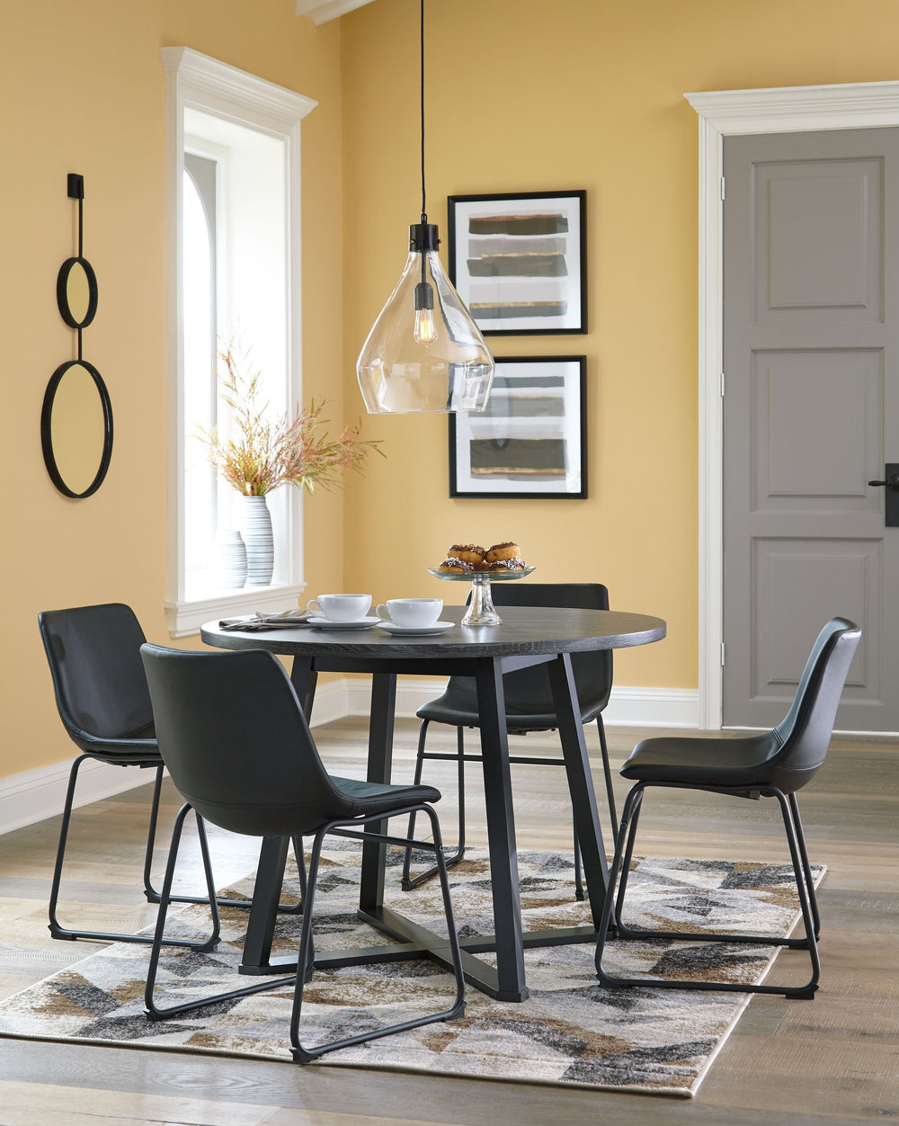 Mid-century inspired design using Mindi veneers, engineered board and hardwood solids. Table tops are made with Mindi veneer with a casual warm brown finish paired with metal base in a brushed dark bronze color finish that has a warm color quality. Angled