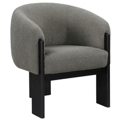Bring updated style and sophistication to your living room or den with a modern accent armchair. It boasts an inviting rounded silhouette with sloping arms. Three legs in a black finish add a sculptural sensibility. Textured boucle upholstery creates rich