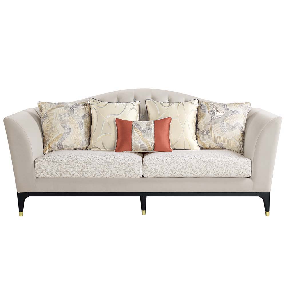 The Tayden camel back sofa brings classic elegance to any living room. Sophisticated curves and crystal-like button tufting adorn the upholstered backrest. For added richness, the seat cushions are upholstered in a geometric fabric. The black base and fee