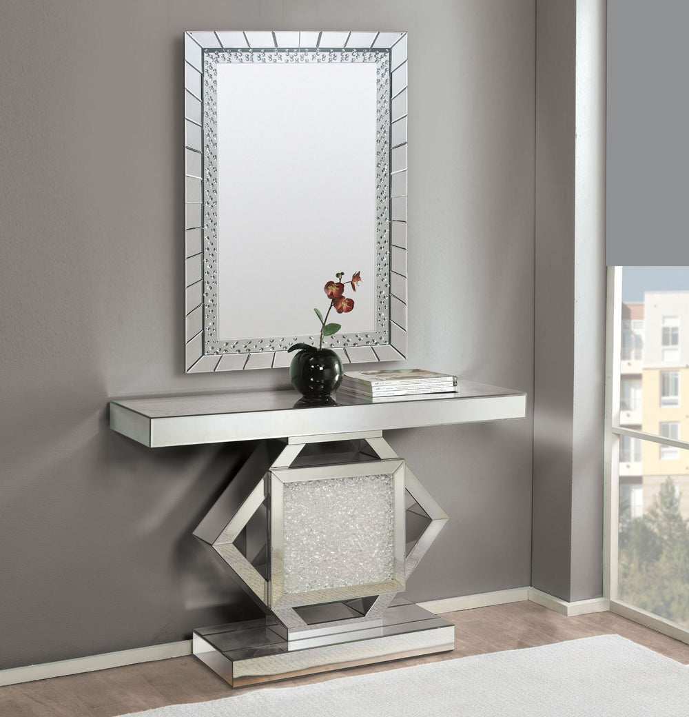 The Nowles mirrored console table demonstrates sophisticated, graceful, elegant style with its unique design. While elegantly reflecting its surroundings, this console table combines glamour with modernism. Light is captured and reflected from all angle o