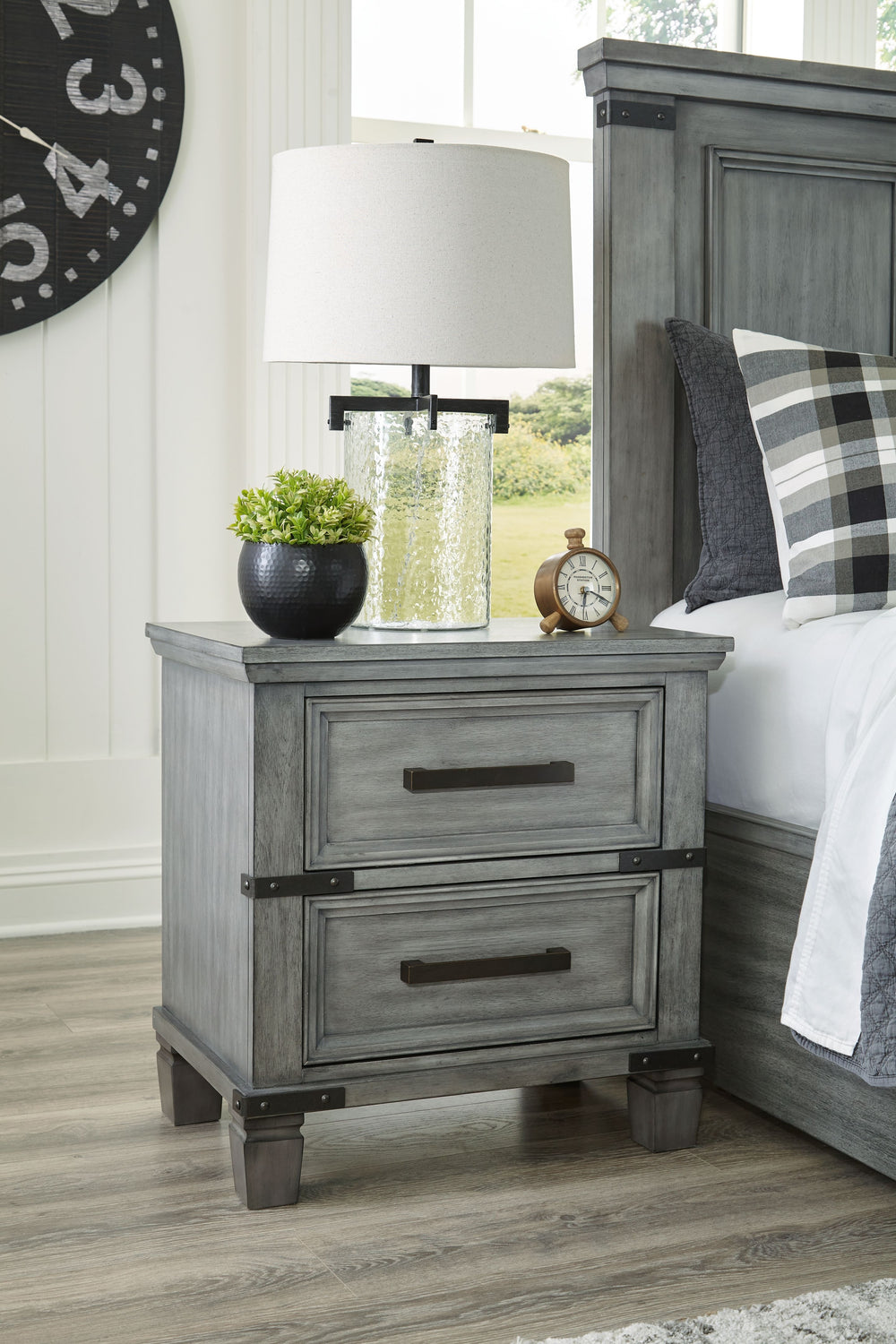What-'s old is what-'s new with this nightstand. Serving up a fresh look in urban farmhouse style, this eclectic piece features a light weathered gray finish with dark aged bronze-tone bar pulls and metal straps for a casually cool sensibility. Profiled d