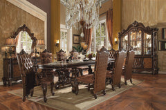 Irresistibly inviting, the Versailles collection displays the unrivaled beauty of the traditional dining. The dining table reflects highly decorative base with oversized scrolled feet, and the upholstered and tapestried chairs with deep button tufted and 