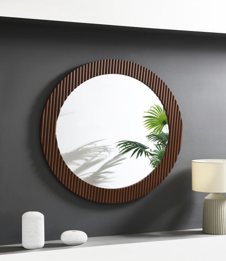 Offer artisan or industrial flair in any space with the textural flair of this round wall mirror. It-'s a modern design that features flat glass for easy reflectivity in any space. The round profile is accentuated with a MDF frame with fluting that create