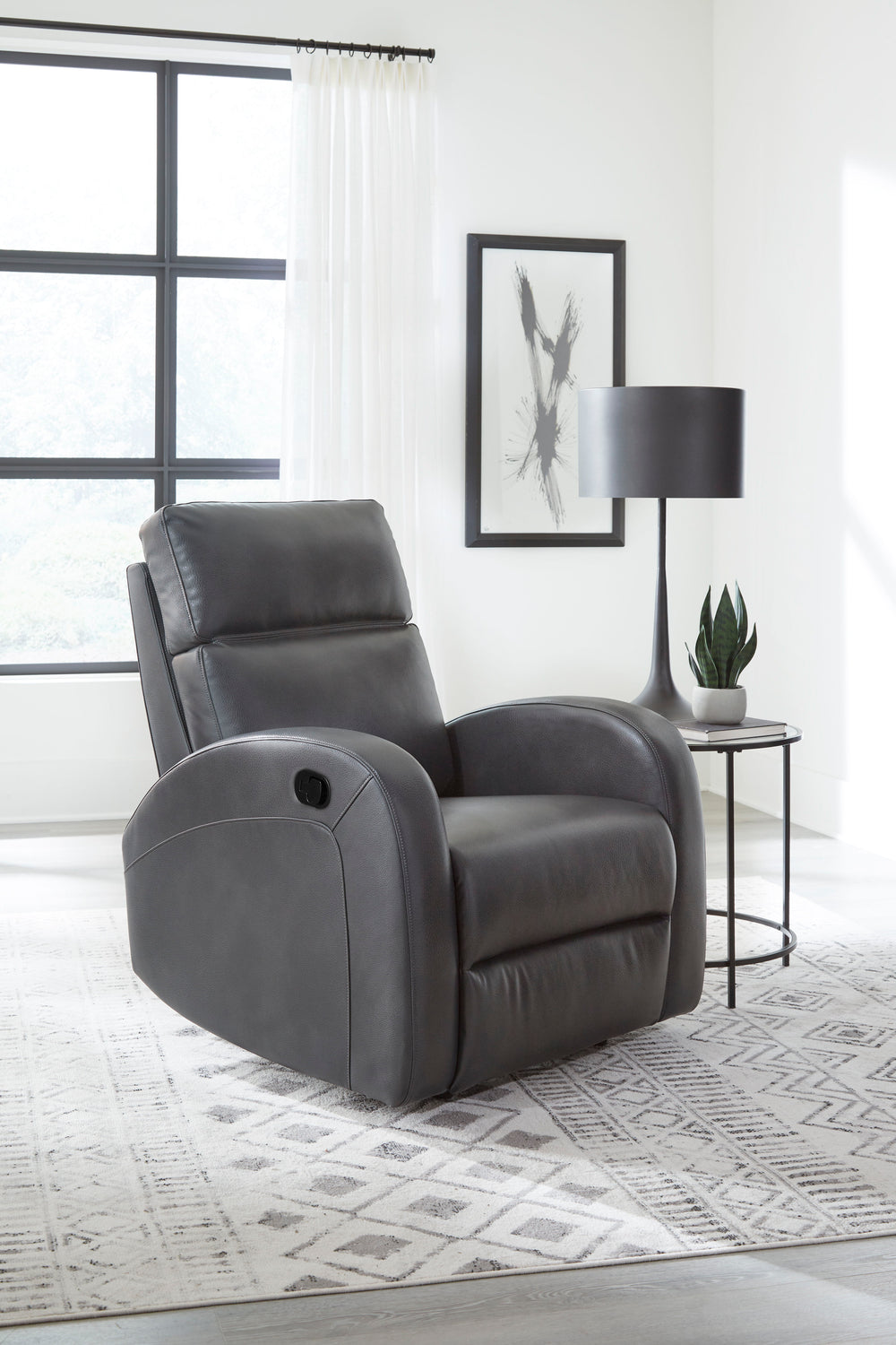 Covered in neutral Pebble Grey fabric and embellished with arched detail stitching, the Devin Manual Recliner features a latch-style handle that is easy-to-operate for the whole family.<br/><br/><b>Product Features</b><ul><li>Manual recline</li><li>High d
