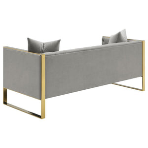  and armchair that lend a Hollywood Regency flair. Wrapped in a soft and light grey velvet upholstery