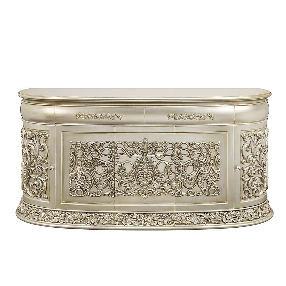 Opulent and magnificent the Sornia dining table will be the focal point of any dining room and is sure to wow guests. The clear glass tabletop allows for the fine details to be enjoyed while dining and will be the topic of conversation throughout the nigh