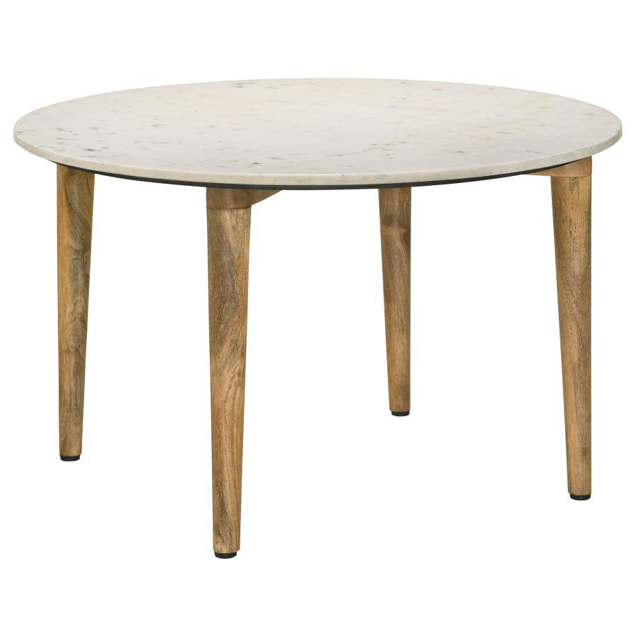 A low-key yet elegant look starts with a hand-crafted round coffee table with earthy tones and plenty of versatility. Choose this coffee table to round out a space with a natural design aesthetic and add a fluid look to a living room or family room. Made 