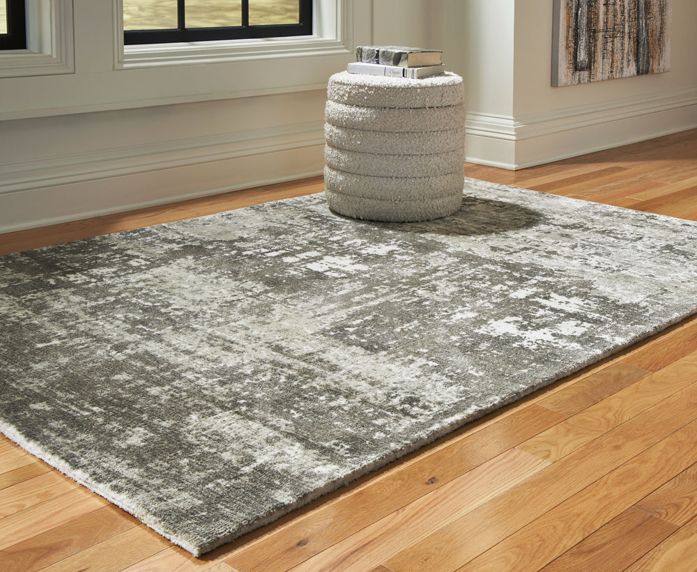 Keep your decor eye-catching from head to toe. Rich with abstract movement, this rug-'s combination of gray and ivory expertly reflects your contemporary color palette. What an artful way to add warmth and comfort underfoot.<br/><br/><b>Product Features</