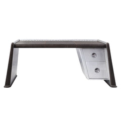 The Brancaster Aluminum Desk-'s modern look and industrial styling are evident in distress chocolate top grain leather top, aluminum over plywood construction, and exposed rivets that form a patchwork over the frame. A brilliant addition to your workspace