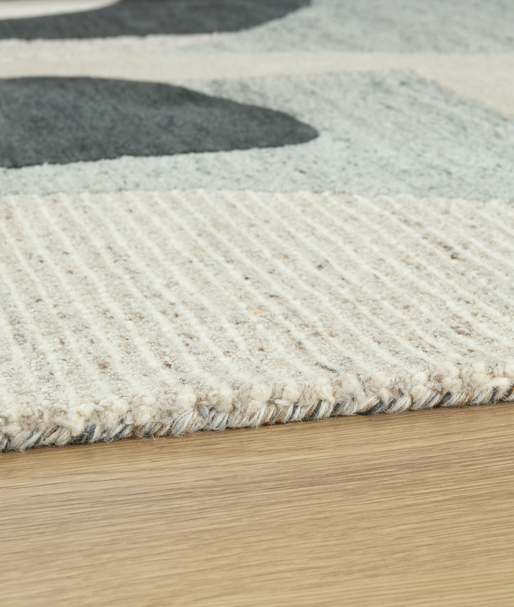 Take a casual approach to mod aesthetics with this rug. Shades of neutral come together in a dynamic abstract pattern, with the high-low construction incorporating eye-catching dimension. Adding a soft feel underfoot, this rug is such a chic combination o