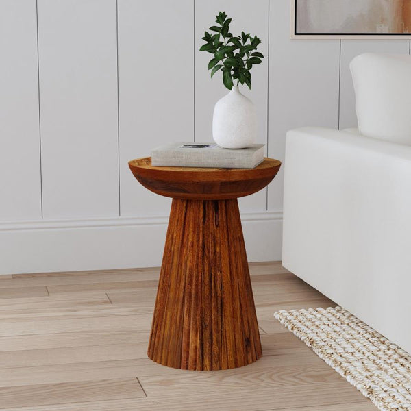  refined silhouette. It-'s adorned with scallop details on its conical pedestal