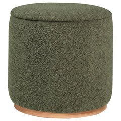 Add a touch of playful luxury to your living space with this round upholstered ottoman, swathed in sumptuous faux sheepskin that invites you to touch. Resting on a metal base that-'s been expertly finished to emulate the warm, natural allure of wood grain