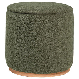 Add a touch of playful luxury to your living space with this round upholstered ottoman, swathed in sumptuous faux sheepskin that invites you to touch. Resting on a metal base that-'s been expertly finished to emulate the warm, natural allure of wood grain