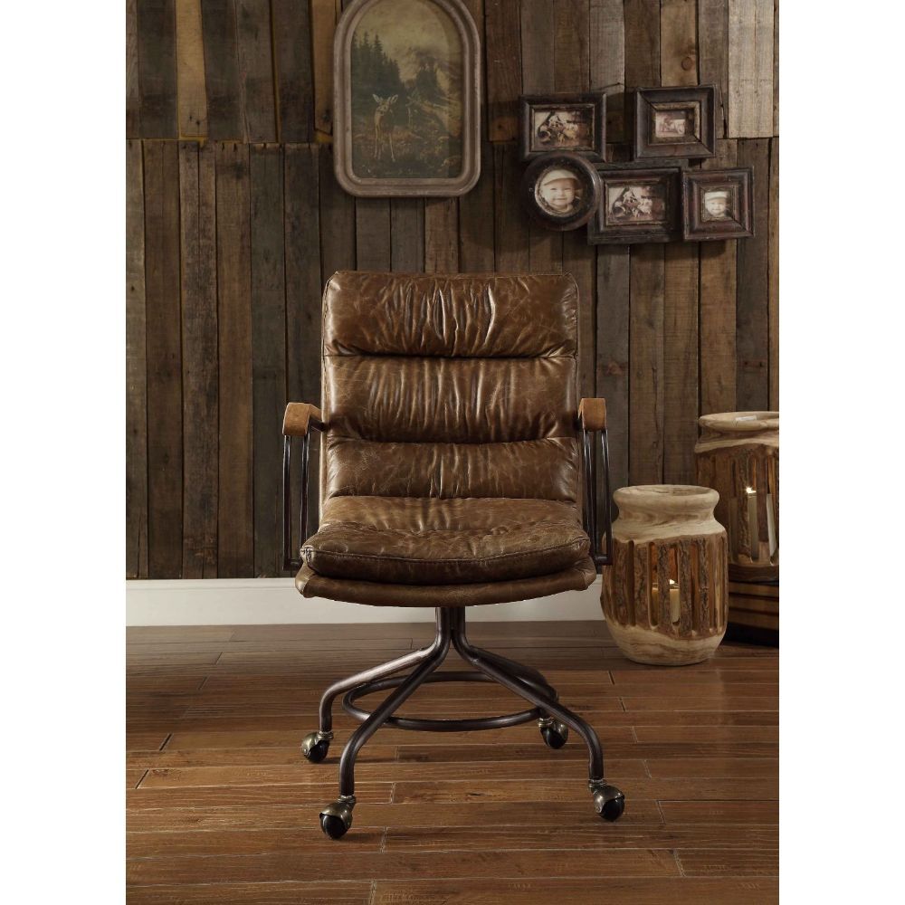 The Harith office chair brings comfort and style to any work space. Handsome, channel-seamed vintage top grain leather upholstery is complemented by a metal base with casters and metal frame armrests. It-'s Industrial design promise comfort and function a