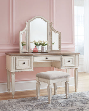  this 3-piece vanity set is your dream bedroom retreat realized. Its antiqued two-tone aesthetic blends a chipped white with a distressed wood finished top for added charm. Framed drawer fronts and a plushl