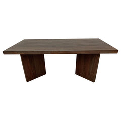 As daylight filters through the windows, it dances upon the surface of a coffee table that exudes a primal elegance. Made from solid mango wood, this rectangular table combines natural charm with timeless durability. Its rich brown finish enhances the woo