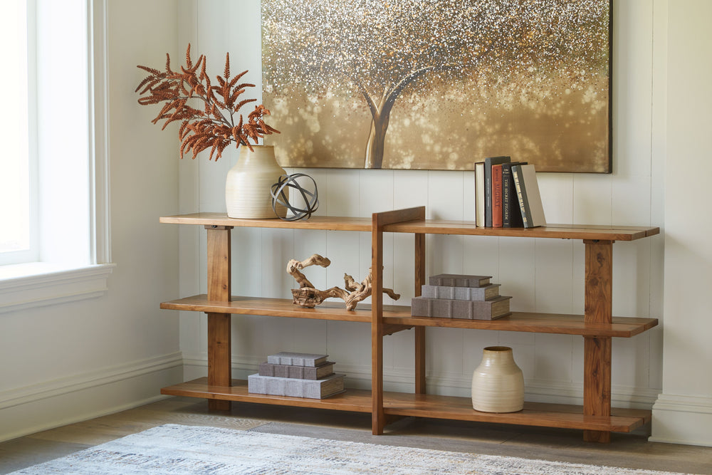 Leaning toward a clean, casually cool look? This solid wood console table is just your style. Its warm honey brown finish exudes an overall relaxed sensibility that feels like home. Three spacious shelves display accents effortlessly.<br><br><b>Additional