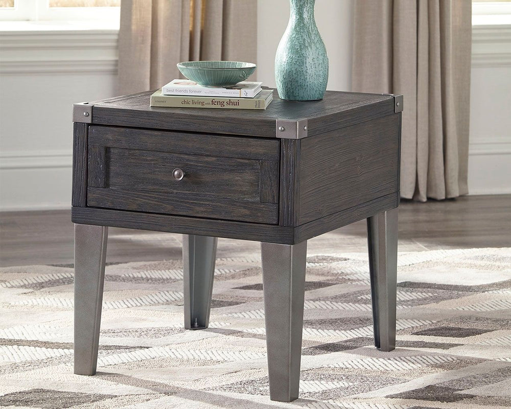 Take a stance for rustic-industrial style with this mixed material end table. Weather-washed pine wood and veneers are contrasted with canted metal legs and corner bracket accents for a uniquely chic merger of earthy beauty and contemporary flair. Power p